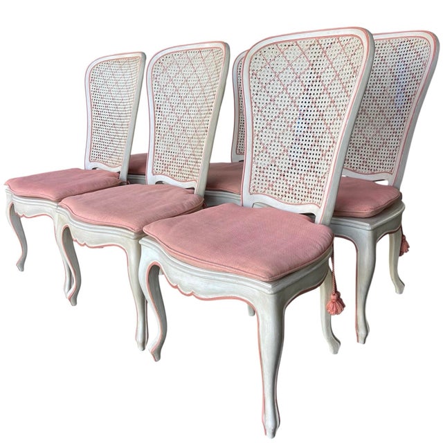Elegant set of six French Provincial / Louis XV style dining chairs featuring hand-finished frames with carved details,...