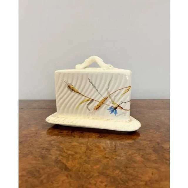 Antique Victorian cheese dish having a shaped handle with leaf decoration to the top with ribbed and floral decoration in...