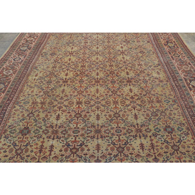 This antique 9x11 Persian Mahal rug is a distinguished early 20th-century weaving celebrated for its finely detailed...