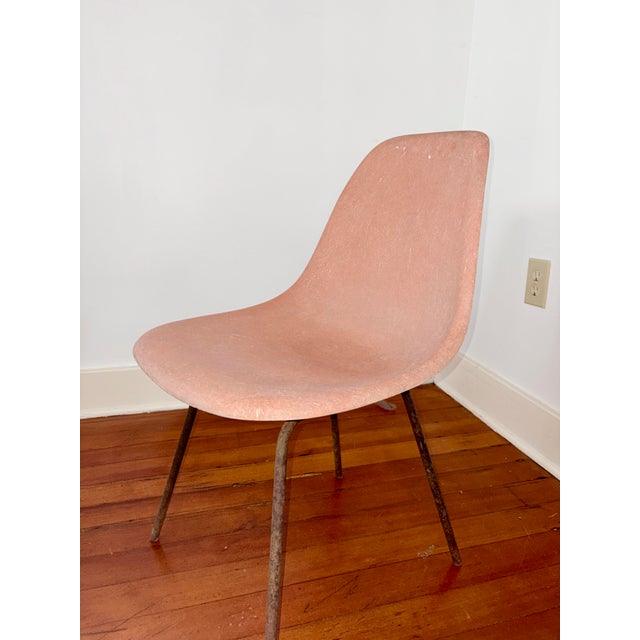 Authentic mid-century Eames fiberglass side shell chair for Herman Miller, featuring the iconic streamlined silhouette...