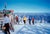 Preparing To Go by Toni Frissell Skiers gather near the top of the piste at the Stowe Mountain resort, Vermont, USA, 1955....
