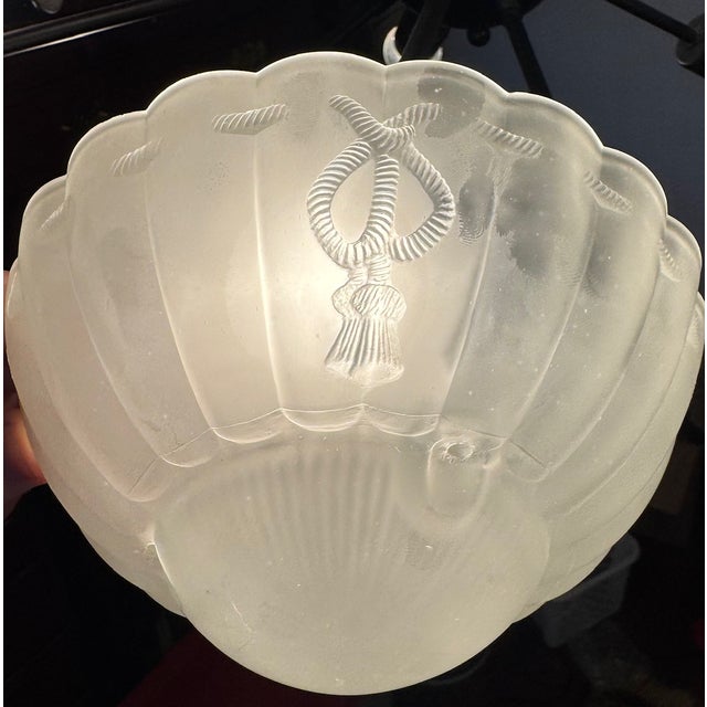 A softly glowing coastal accent—this vintage frosted glass shade transforms light into atmosphere. A vintage frosted glass...
