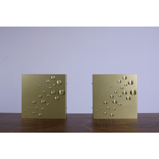 Two characteristic sculptural wall lights produced by the raak lighting company in the 1960ies. The model is called...