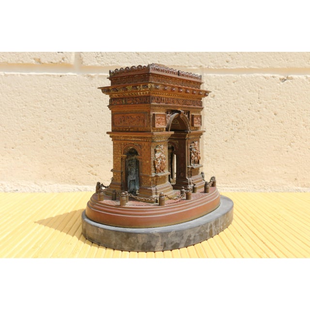 Wonderful statue of the Arc De Triomph made of bronze and marble. It has so many details. It is in good vintage condition...