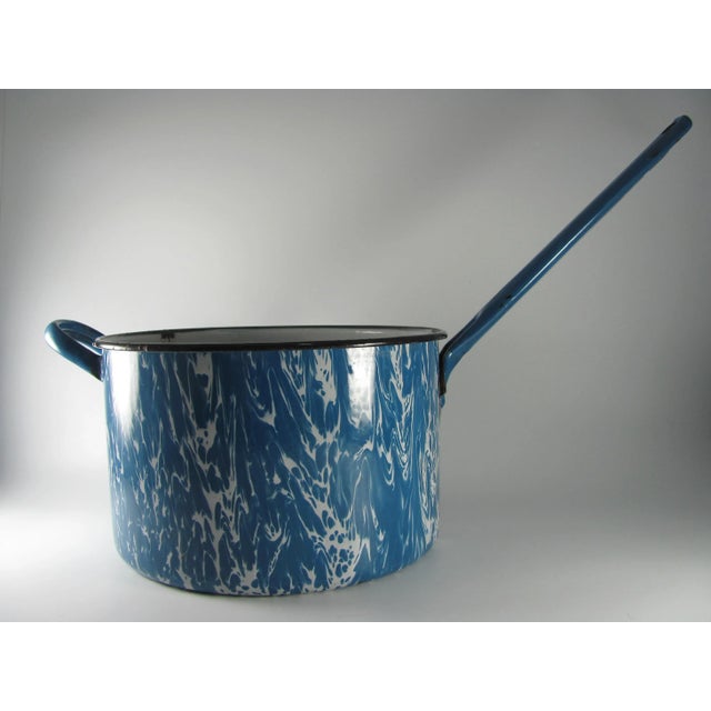 Perfect for display in a farmhouse or cabin, this enamelware lidded pot would be a nice Americana addition at a distance...