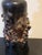 Beautiful gilt Icelandic lava vase. The vase is handmade and glazed green with fragments of volcanic lava forming a...