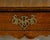 An English Georgian period oak side table from the 18th century with single drawer, carved apron and brass Chippendale...