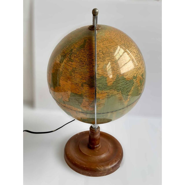 Vintage petite illuminated globe. Made in the late 20th Century.