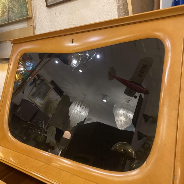 Special Italian bar/bureau cabinet from the 1960s. Designed in maple wood, it provides a beautiful honey color with the...