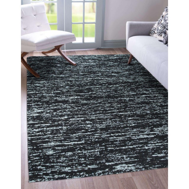 Fiona Rustic Black Flatweave Wool Rug, Country of Origin: India. This contemporary flatweave piece reinterprets...