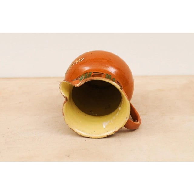 French 19th Century Terracotta Pitcher from Génolhac with Russet Colored Glaze For Sale - Image 11 of 12