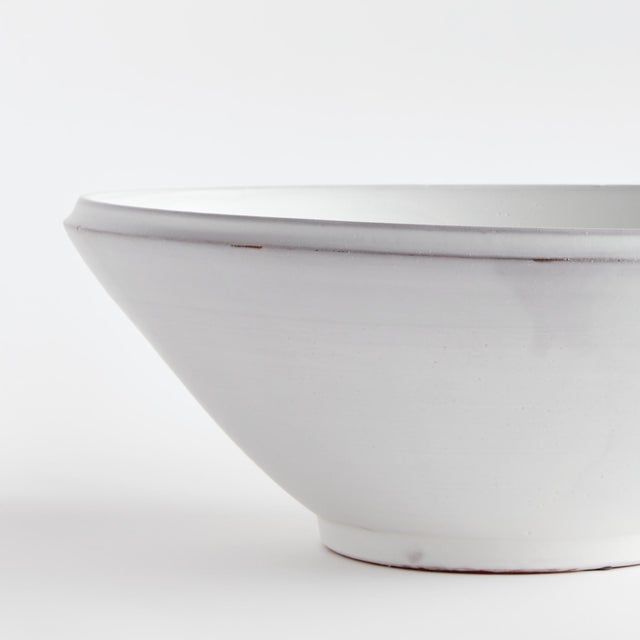 This handthrown terracotta bowl is finished with a warmWhite glaze and has soft visible throw lines which only add to its...