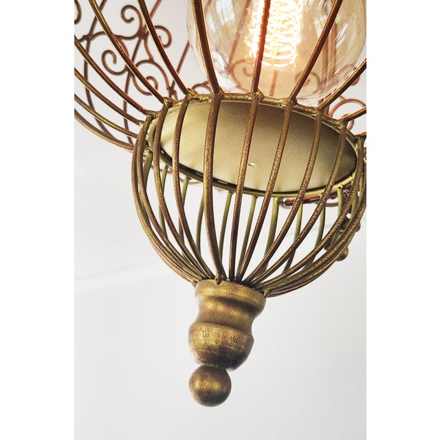 Charming vintage decorative birdcage transformed into a unique ceiling light fixture. Making it a one of a kind. Finished...