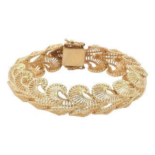 Mid 20th Century Fancy Open 15mm Wide 14k Yellow Gold Swirl Link Bracelet For Sale