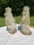 A matching pair of vintage cast concrete lion statues bearing armorial decoration.
