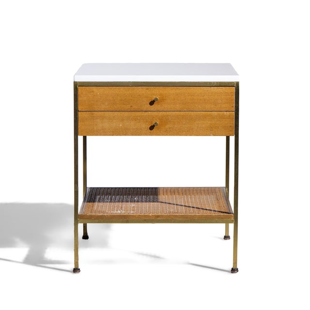 Paul McCobb for Calvin Irwin Group Model 8714 Mid Century Bleached Mahogany, Cane, Brass and Glass Nightstand This...