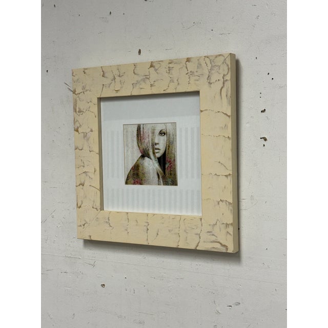 Design Plus Gallery presents a Framed Portrait of a Blonde Woman. The image is captivating with the mysterious blond...