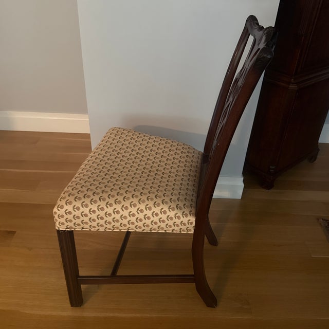 8 chairs and 2 chairs with arms. (Set of 10) mahogany armchair, with a pierced/openwork splat back and upholstered seat. A...