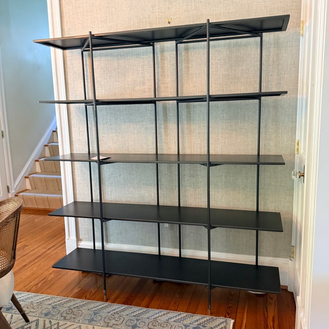 Four Hands Vito Bookshelf Modern industrial design gets softened by fine lines. Wide planks of distressed iron offer...