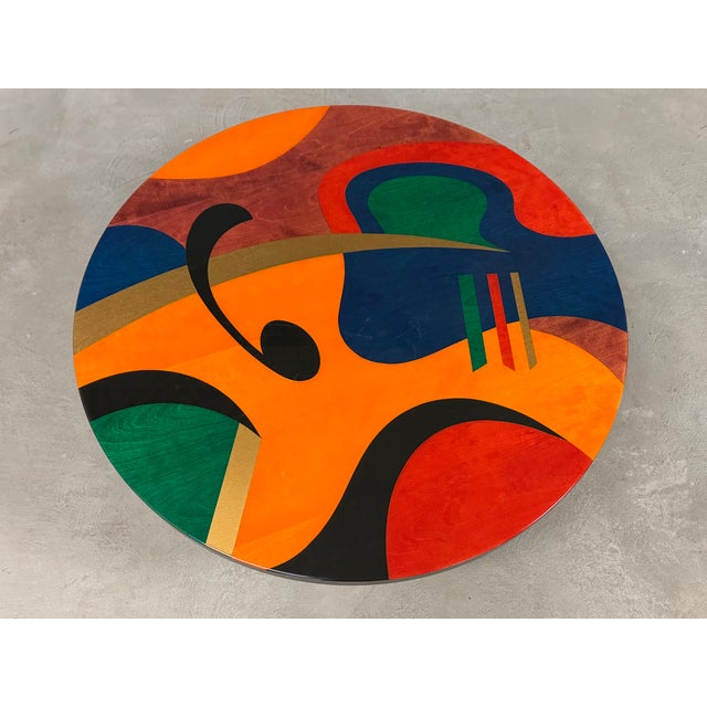 A post modern abstract Memphis style colorful round coffee table with an epoxy finish made by Benjamin Le. Excellent...