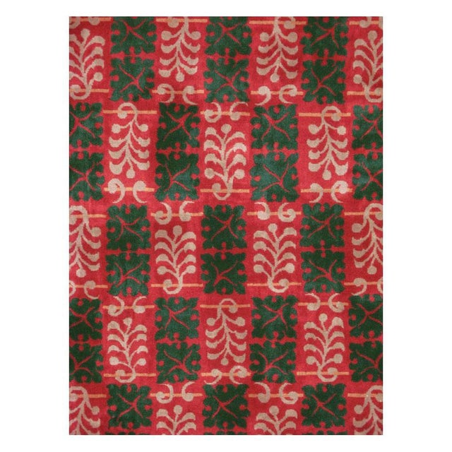 A vintage Chinese Art Deco rug handmade during the mid-20th century predominantly in red, green, and antique white, and...