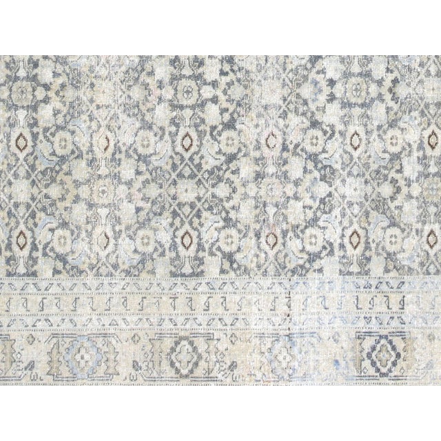 This lavish hand-knotted Persian Tabriz rug adds the perfect touch of elegance to any space. Its intricate design features...