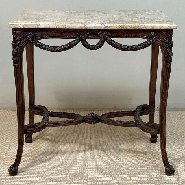 A beautifully proportioned Belgian Louis XVI transitional table, crafted in rich solid walnut and reflecting the graceful...