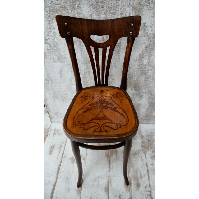 This is a charming Edwardian childs correction chair, made from bentwood with its hand turned uprights and a hand carved...