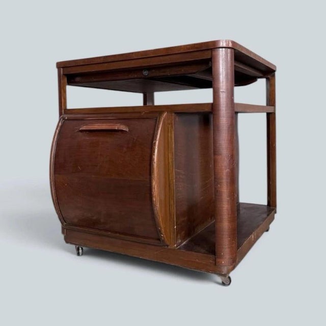 a rare british cc41 walnut cocktail trolley and drinks cabinet by incorporall. Its ingenious metamorphic design provides...