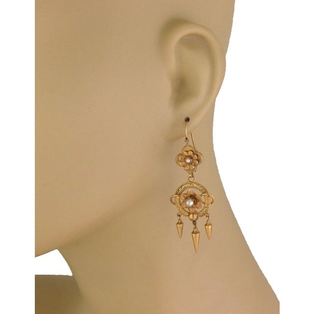 These beautiful Art Nouveau earrings are crafted from 15k yellow gold with a matte and satin finish. The the top part of...