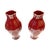 A striking pair of vintage vases by Maitland-Smith, finished in a rich oxblood red glaze. These sculptural vessels feature...