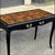 This is a French Louis XIV style desk with a faux tortoise finished top. The desk is marked. The antique hardware is gilt...