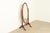 A gorgeous antique Victorian carved mahogany tilting full length cheval floor mirror In the manner of R.J. Horner & Co....