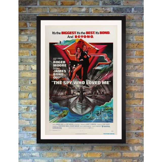 A dynamic us one sheet poster for the 1977 blockbuster bond classic 'the spy who loved me', designed by legendary poster...