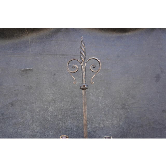 Monumental Spanish Revival wrought iron torchiere floor lamp, dating to the 1920s, featuring an exceptionally large...