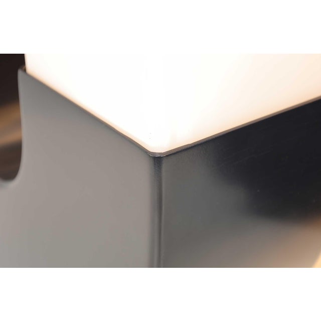 A unique pair of large-scale sculptural table lamps by Modeline. The lamps have Lucite shades that rest on a high density...