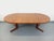 Vintage Scandinavian round dining table from the 1960s, in the Baumann style, made of teak, with a beautiful top featuring...