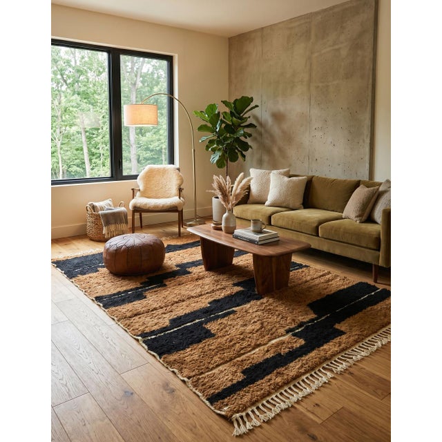 Brown and Black Moroccan Rug – Handmade Abstract Berber Wool Rug This striking handmade Moroccan rug features a warm...