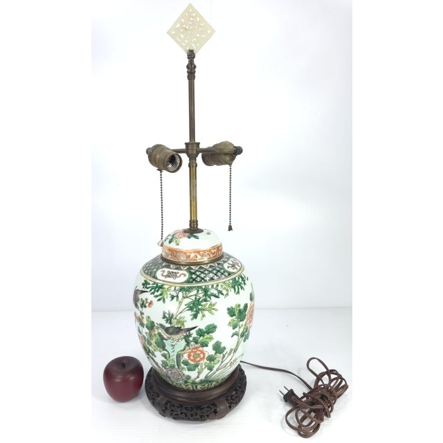 Offered is this lovely antique Chinese Ginger Jar lamp. It is decorated with flitting birds in flowered branches. The base...