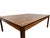 Elegant Danish Modern rosewood coffee table featuring a rich, warm brown finish and striking grain patterns across its...