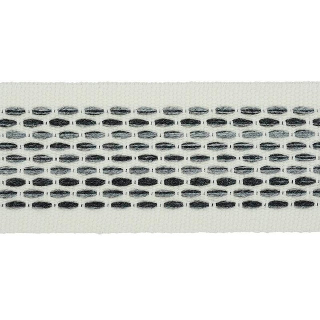 Stitches in variegated tones form a dappled stripe pattern on an understated high-performance tape with loads of tactile...