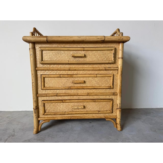 Bring coastal charm and natural warmth into your space with this vintage bamboo set, consisting of a three-drawer...