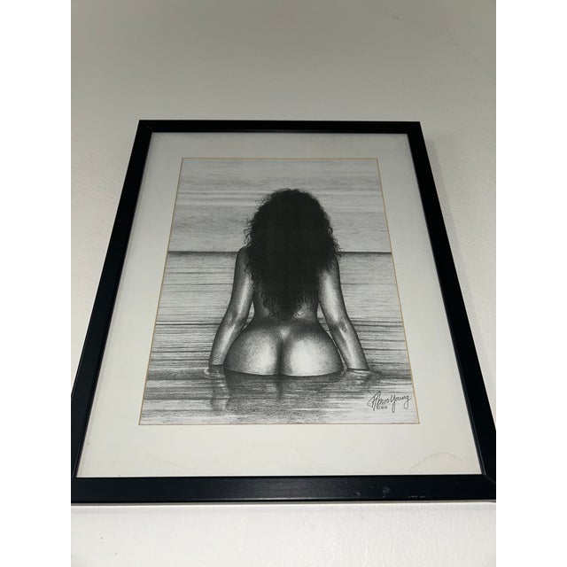 An original graphite drawing titled “And God Created Woman” (2011) by the late Jamaican artist Howard Moo Young. This...