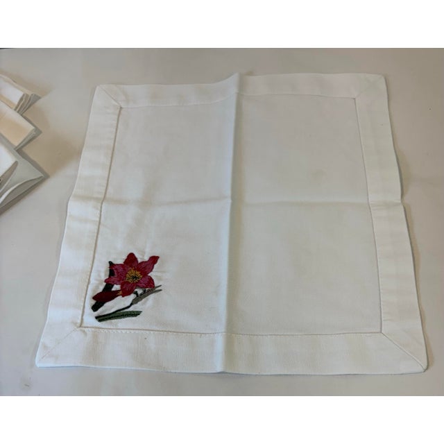 Pretty set of 4 cocktail napkins with embroidered floral corner detail