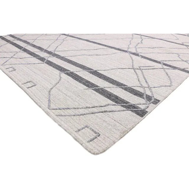 contemporary gray modern Moroccan style area rug with raised design, texture area rug. Warm hygge vibes meet tribal...