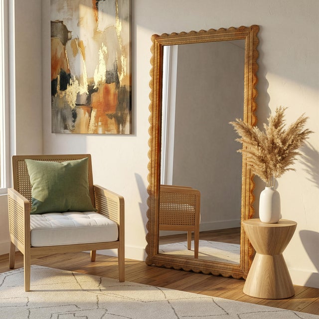 The Butler Specialty Company Flora Full Length Floor Mirror radiates natural charm with its handwoven rattan frame and...