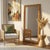 The Butler Specialty Company Flora Full Length Floor Mirror radiates natural charm with its handwoven rattan frame and...