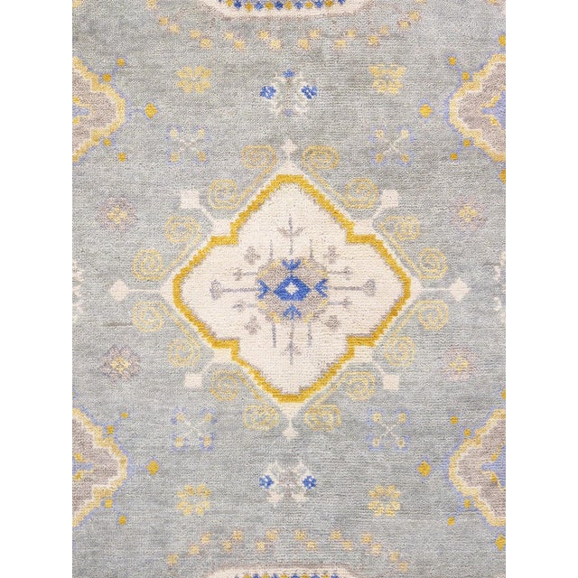 Khotan hand-knotted rugs are quite unique folk artifacts which display elements of rich, historical cultures. These rugs...