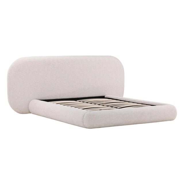 Queen sized modern charming platform bed upholstered in white basketweave boucle. Extra wide headboard with rounded cloud-...