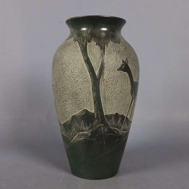 Discover a piece of artisanal history with this rare vintage soapstone vase, an authentic creation that combines the...